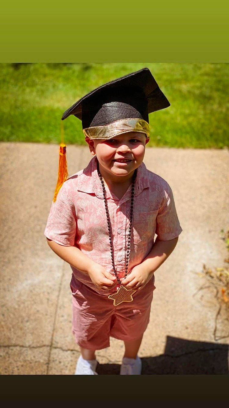 Javien joined the competition — help win amazing prizes! academic_dress, cap, costume, event, eyewear, face, fashion_accessory, fun, grass, happy, headgear, headwear, human_body, jewellery, joy, mortarboard, person, plant, scholar, smile