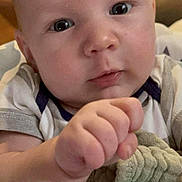 Blaine joined the competition — help win amazing prizes! baby, infant, face, hand, teething_toy, blanket, closeup, curious, indoors, child, cute, skin, person, clothing, young, portrait, expression, soft, comfort, toy