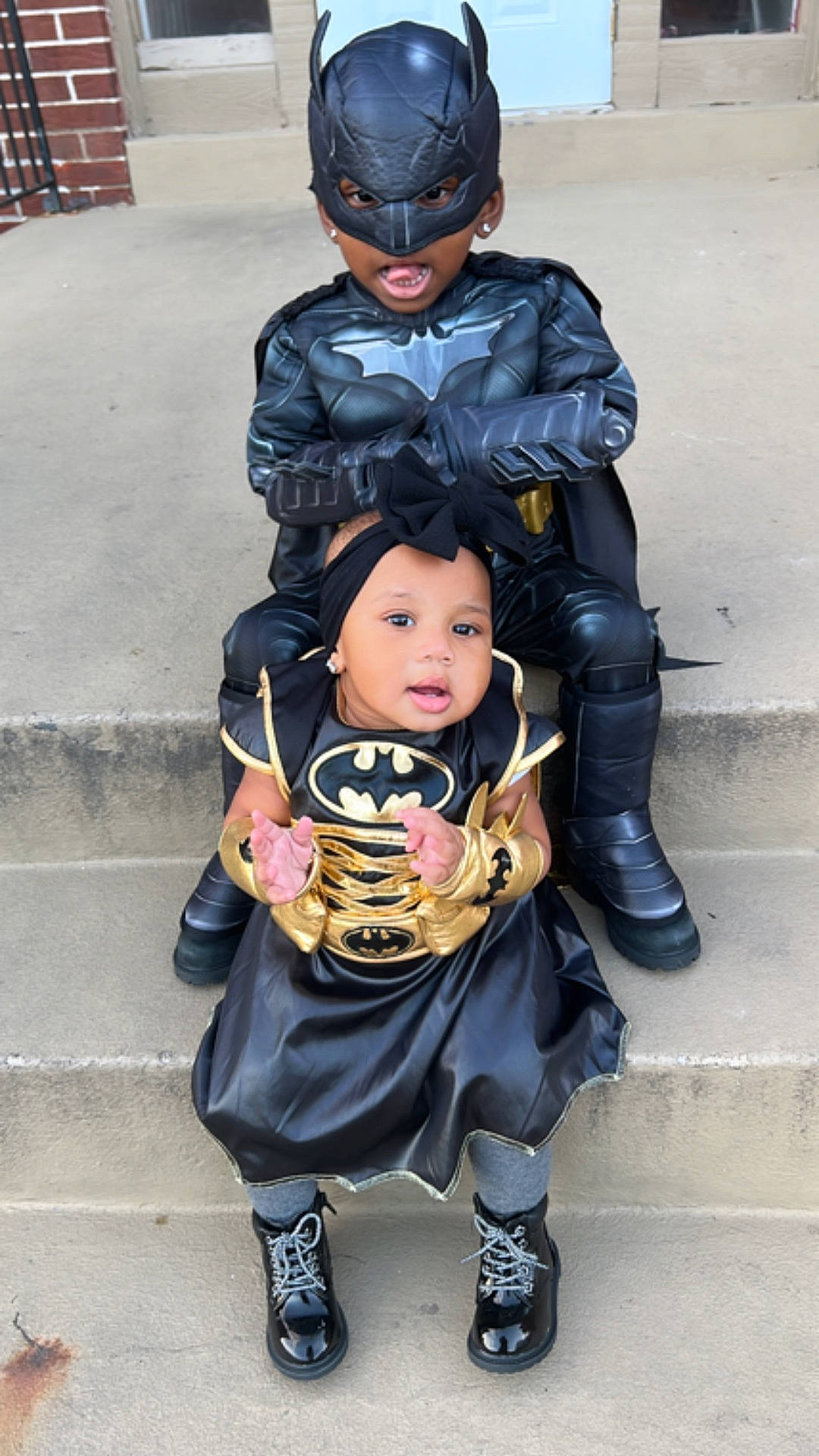 Promise Regans is registered to the contest to win money with this photo: baby, boot, clothing, coat, costume, crashhelmet, face, footwear, glove, head, helmet, jacket, pants, path, people, person, photography, portrait, shoe, walkway