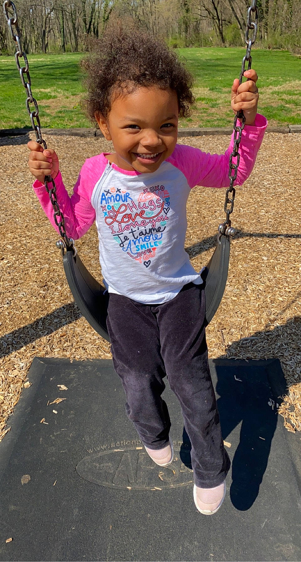 Ahniya joined the competition — help win amazing prizes! arm, black, child, eye, face, facial_expression, fun, hairstyle, happy, head, joy, leisure, person, photograph, pink, playground, public_space, sleeve, smile, swing