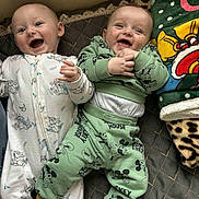Isaac Et ézio participe au concours pour gagner de l'argent avec cette photo : baby, smiling, pajamas, mickey_mouse, blanket, cartoon, infant, cute, happy, child, bed, sleepwear, portrait, two_children, lying_down, cozy, indoor, playful, patterned_clothing, toddler