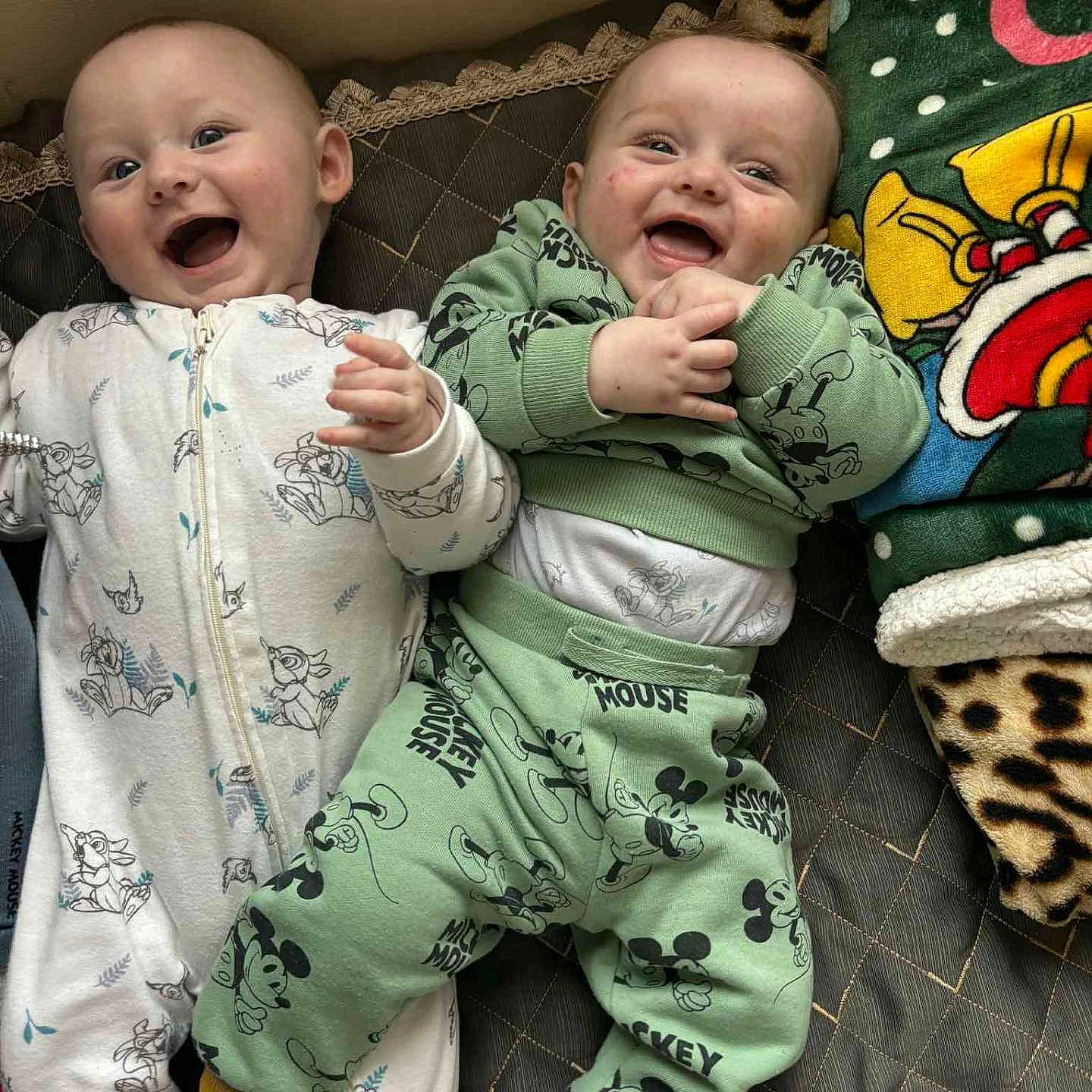 Isaac Et ézio participe au concours pour gagner de l'argent avec cette photo : baby, bed, blanket, cartoon, child, cozy, cute, happy, indoor, infant, lying_down, mickey_mouse, pajamas, patterned_clothing, playful, portrait, sleepwear, smiling, toddler, two_children