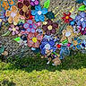 colorful, corgi, crocheted_flowers, cute, decoration, dog, flowers, grass, greenery, happy, harness, leash, nature, outdoor, pattern, playful, puppy, sunny, texture, wall