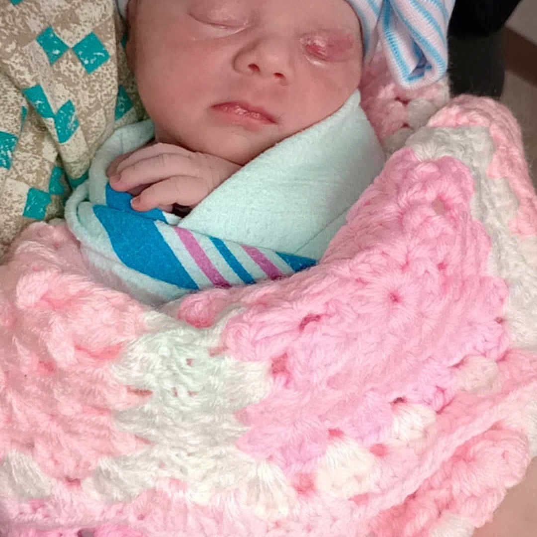 Ivory is registered to the contest to win money with this photo: architecture, baby, bed, blanket, building, clothing, cushion, face, furniture, glove, hat, head, homedecor, newborn, person, photography, portrait, quilt, sleeping, towel