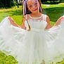 braided_hair, butterfly, child, face_paint, fashion, girl, grass, happy, nature, outdoor, park, playful, portrait, purple_shoes, ribbons, smiling, summer, sunlight, trees, white_dress