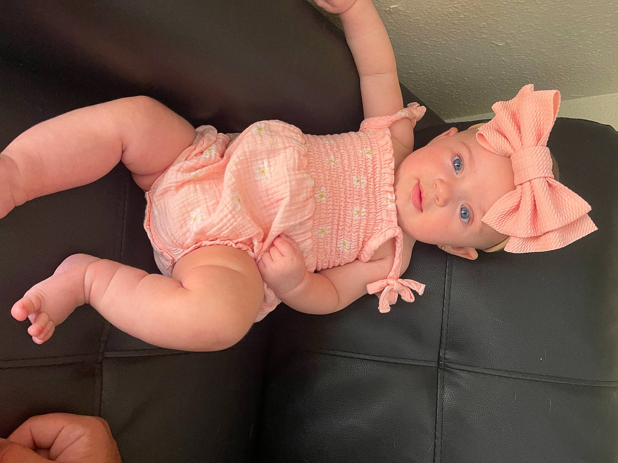 Hailey is registered to the contest to win money with this photo: baby, baby_toddler_clothing, cheek, dress, eye, fawn, finger, gesture, headgear, headwear, human_body, iris, leg, lip, nail, person, pink, skin, stomach, thumb