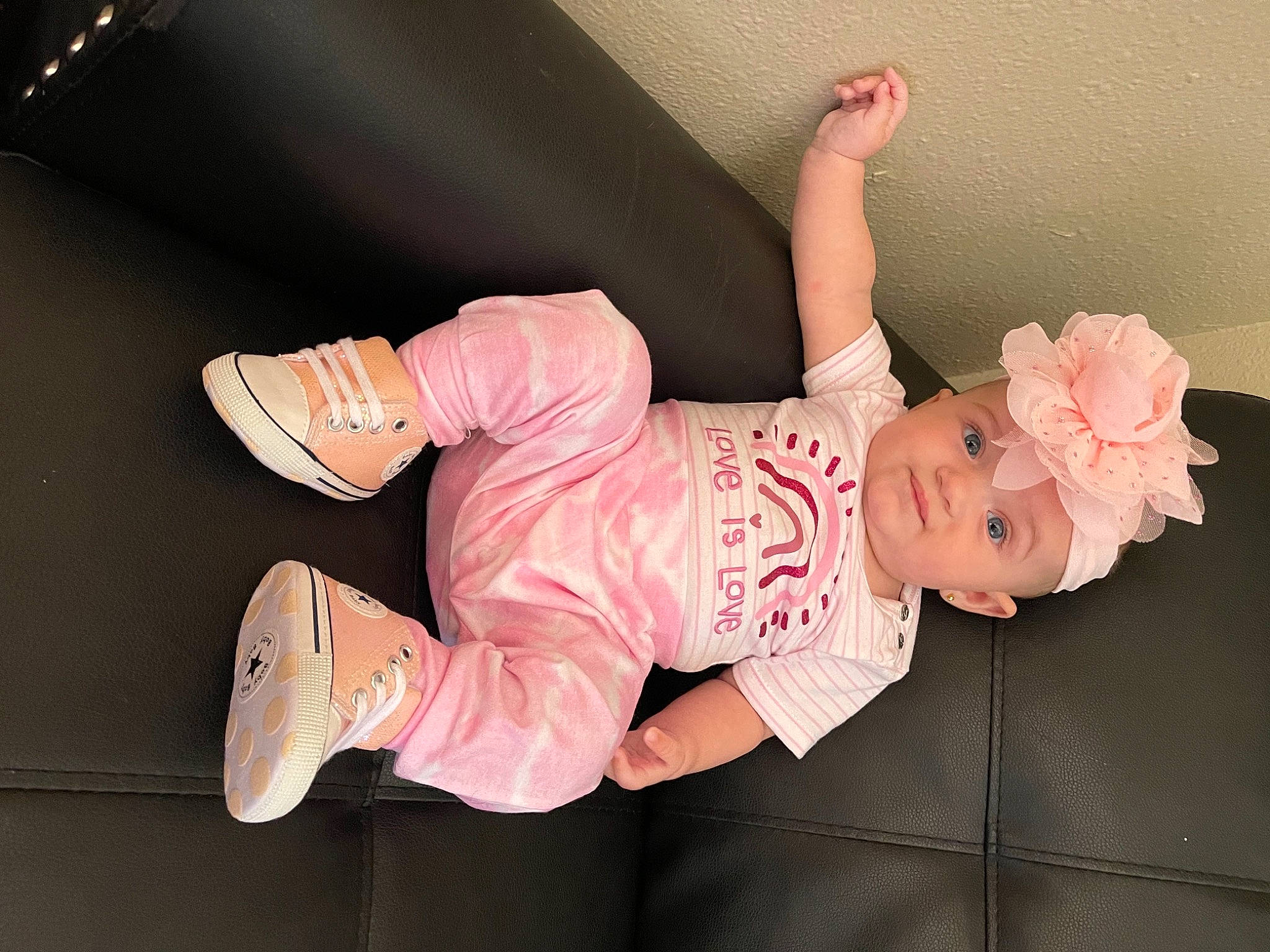 Hailey is registered to the contest to win money with this photo: arm, baby, baby_toddler_clothing, child, finger, foot, footwear, hand, happy, hat, headwear, human_body, human_leg, leg, person, pink, skin, sleeve, thigh, thumb