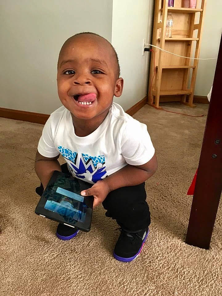 Jakhari is registered to the contest to win money with this photo: baby, baby_toddler_clothing, child, electric_blue, finger, floor, flooring, fun, hairstyle, happy, hardwood, joy, person, product, shelf, sleeve, smile, standing, t_shirt, toddler