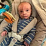 baby, baby_seat, blanket, child, comfort, cozy, cushion, cute, eyes, face, hand, harness, indoor, infant, newborn, onesie, person, portrait, striped_clothing, toy