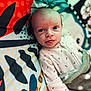 Harry joined the competition — help win amazing prizes! baby, blanket, clothing, colorful, cute, expression, face, head, indoors, infant, lying_down, patterned_background, person, playful, portrait, skin, sleepwear, soft_texture, tongue_out, young_child