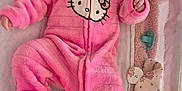 Tabitha is registered to the contest to win money with this photo: baby, baby_accessories, baby_bedding, blanket, child, cozy, cute, diapers, face, footed_pajamas, hello_kitty, indoors, infant, pacifier, pink_onesie, portrait, resting, sleepwear, smiling, soft_toy
