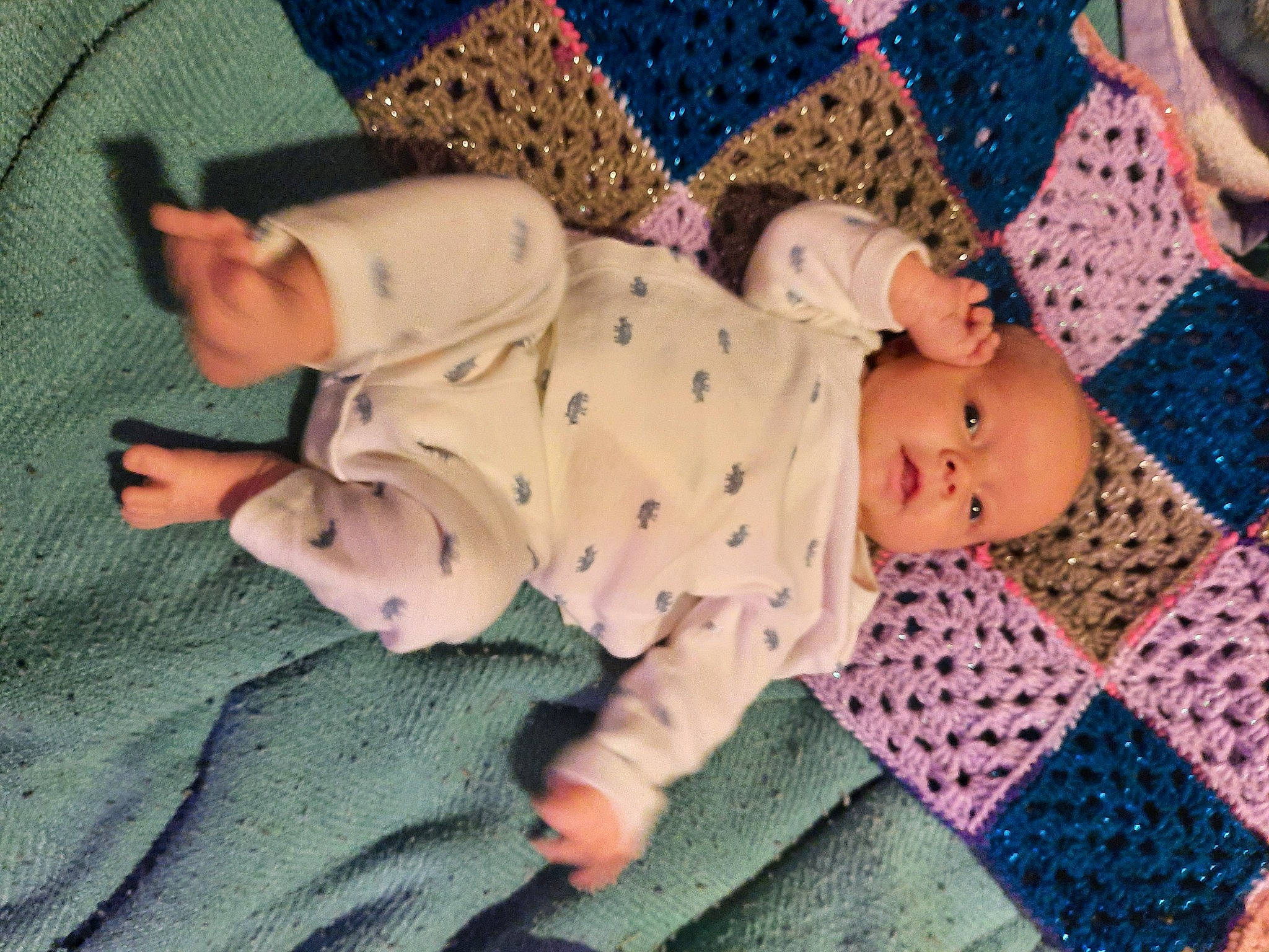 Jupiter joined the competition — help win amazing prizes! baby, baby_products, baby_toddler_clothing, bedtime, child, comfort, face, facial_expression, fun, linens, pattern, person, pink, room, sitting, sleeve, sock, textile, toddler, vertebrate