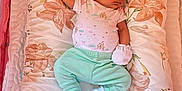 Lillian joined the competition — help win amazing prizes! baby, newborn, sleeping, crib, pillow, floral_pattern, onesie, mittens, socks, green_pants, baby_wipes, pampers, blanket, soft_toys, infant, rest, cozy, nursery, baby_care, peaceful