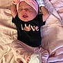 Lillian is registered to the contest to win money with this photo: baby, sleeping, onesie, pink_headband, mittens, blanket, hand, infant, cute, soft_fabric, newborn, peaceful, clothing, person, lying_down, indoor, child, toddler, pink, black