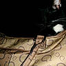 Oreo joined the competition — help win amazing prizes! cat, tuxedo_cat, black_cat, white_chest, animal, pet, feline, whiskers, fur, portrait, close_up, indoors, dark_background, handbag, purse, fabric, patterned, fashion_accessory, resting, cute