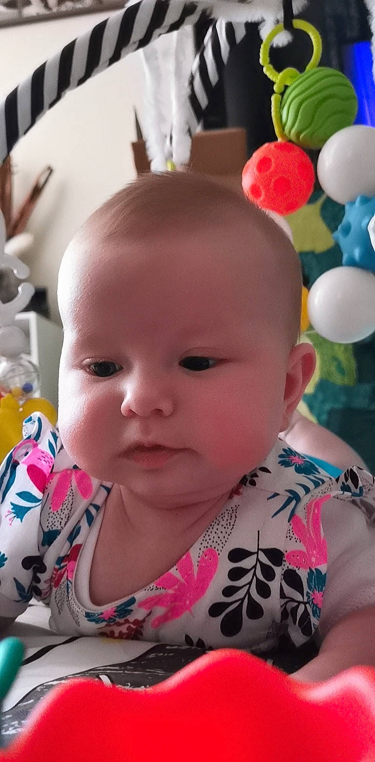 Lana participe au concours pour gagner de l'argent avec cette photo : baby, baby_carriage, baby_products, baby_toddler_clothing, cheek, child, ear, eye, eyelash, fun, happy, iris, nose, person, pink, play, sitting, skin, textile, toddler