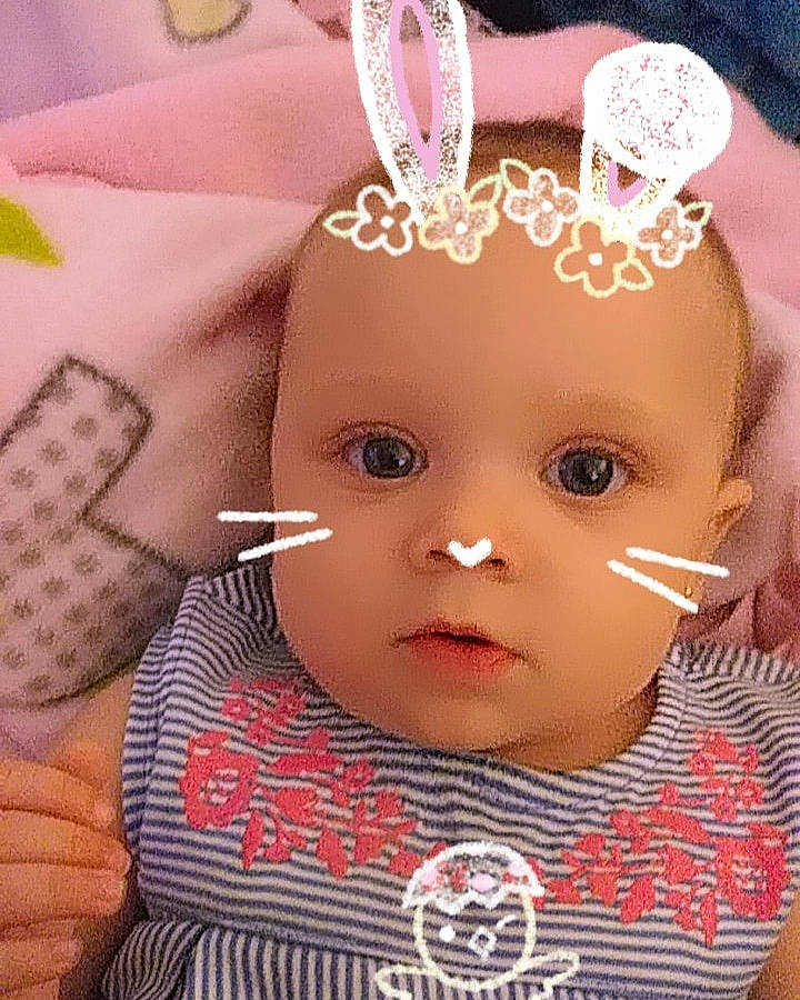 Jealiah'Marie is registered to the contest to win money with this photo: baby, cheek, child, doll, ear, eyebrow, eyelash, face, fashion_accessory, forehead, hair_accessory, head, headgear, lip, person, pink, skin, toddler, toy