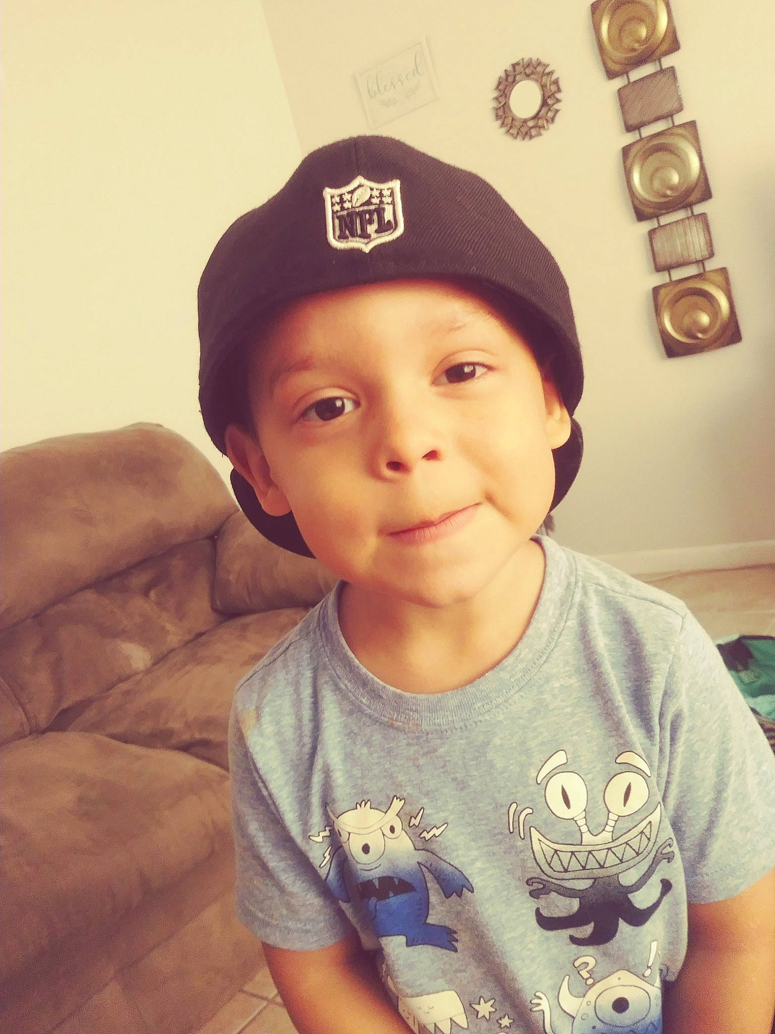 Edward Omar is registered to the contest to win money with this photo: baseball_cap, beanie, cap, child, cool, fashion_accessory, forehead, happy, head, headgear, person, photography, selfie, smile, t_shirt, toddler