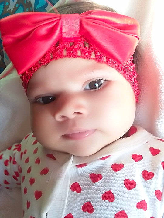 Yuliana is registered to the contest to win money with this photo: beauty, cheek, child, child_model, ear, face, forehead, girl, hair_accessory, head, headband, headgear, infant, iris, lip, person, pink, product, skin, smile