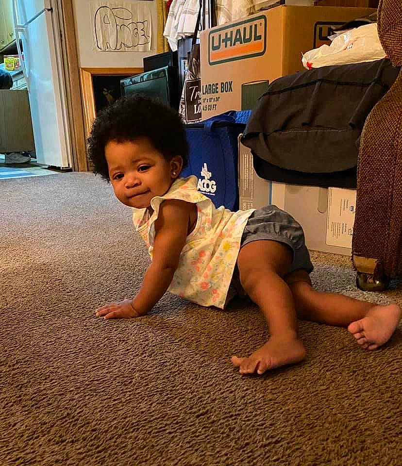 Amara joined the competition — help win amazing prizes! baby, child, floor, flooring, fun, leg, person, play, sitting, smile, toddler