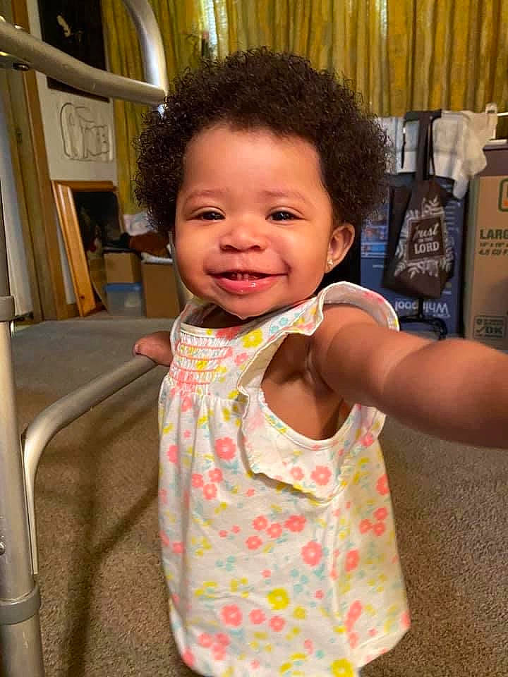 Amara joined the competition — help win amazing prizes! baby, cheek, child, dress, joy, person, shoulder, skin, smile, toddler, vacation