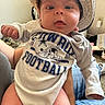 Alora joined the competition — help win amazing prizes! baby, carpet, casual, child, clothing, cowboy_hat, curious, cute, dallas_cowboys, expression, football_onesie, hand, hat, holding, indoors, infant, legs, person, portrait, sitting