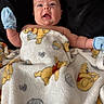 adorable, baby, blanket, child, comfort, cozy, cute, expression, face, head, indoor, infant, lying_down, mittens, portrait, skin, smiling, soft_texture, winnie_the_pooh, young