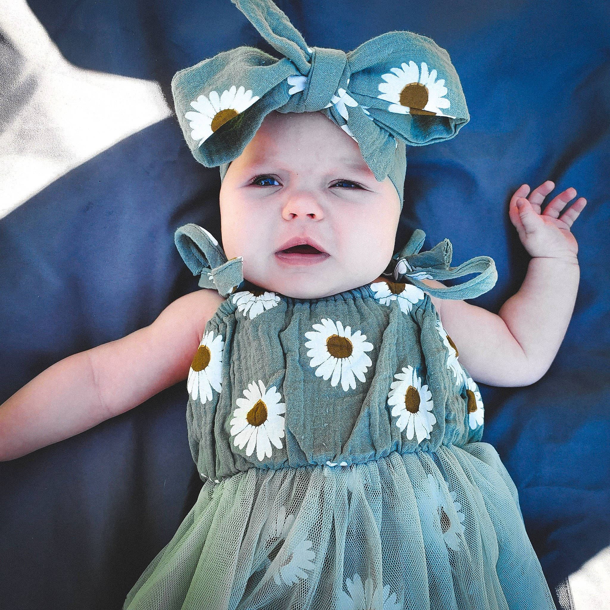 Maddison is registered to the contest to win money with this photo: baby, baby_toddler_clothing, cheek, child, costume_hat, dress, eye, face, facial_expression, happy, head, headgear, headwear, human_body, iris, organ, person, pink, skin, sleeve