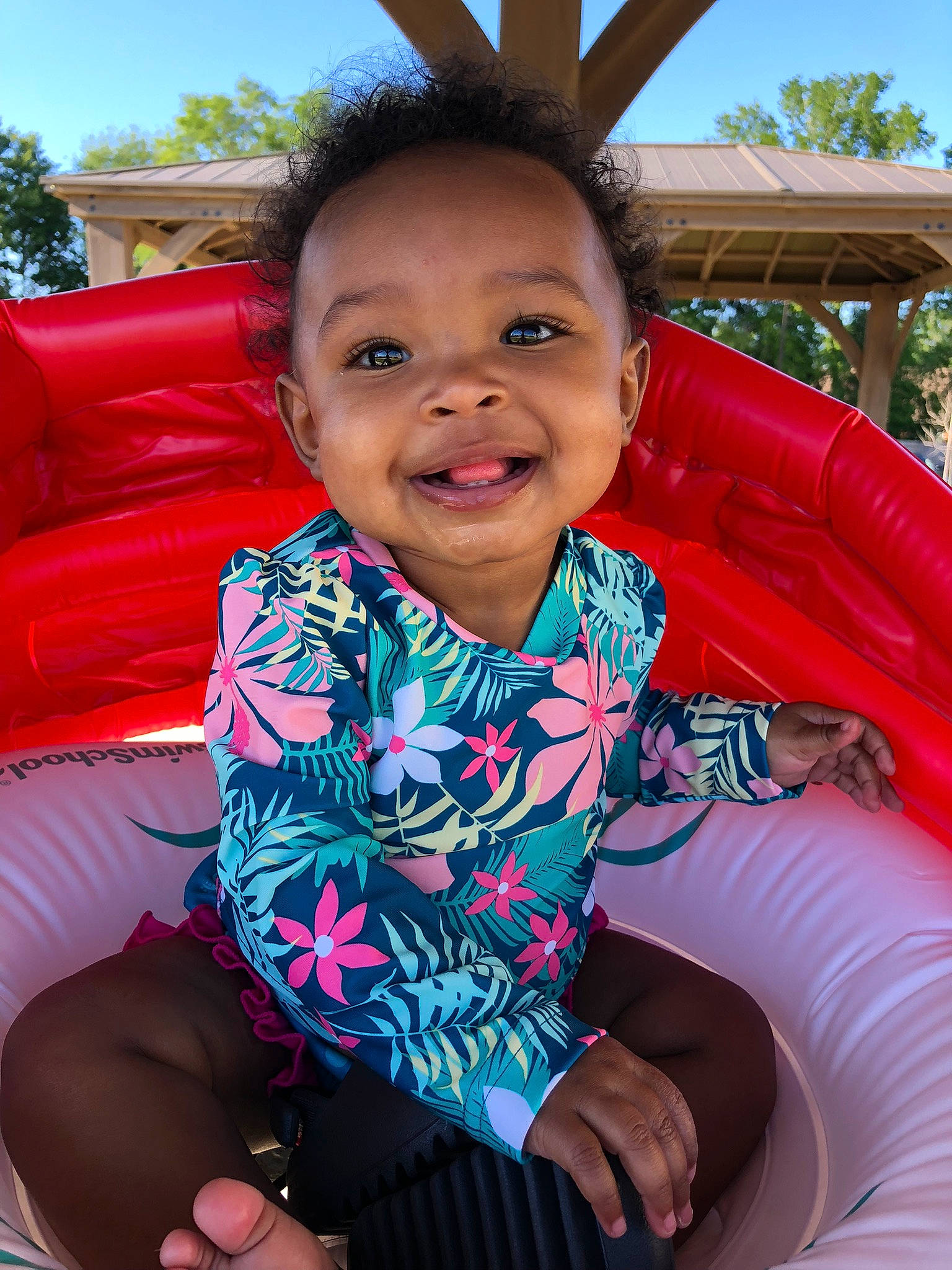Kamari is registered to the contest to win money with this photo: azure, black, blue, child, comfort, electric_blue, event, fun, happy, joy, lap, leisure, person, pink, recreation, red, skin, sky, smile, toddler