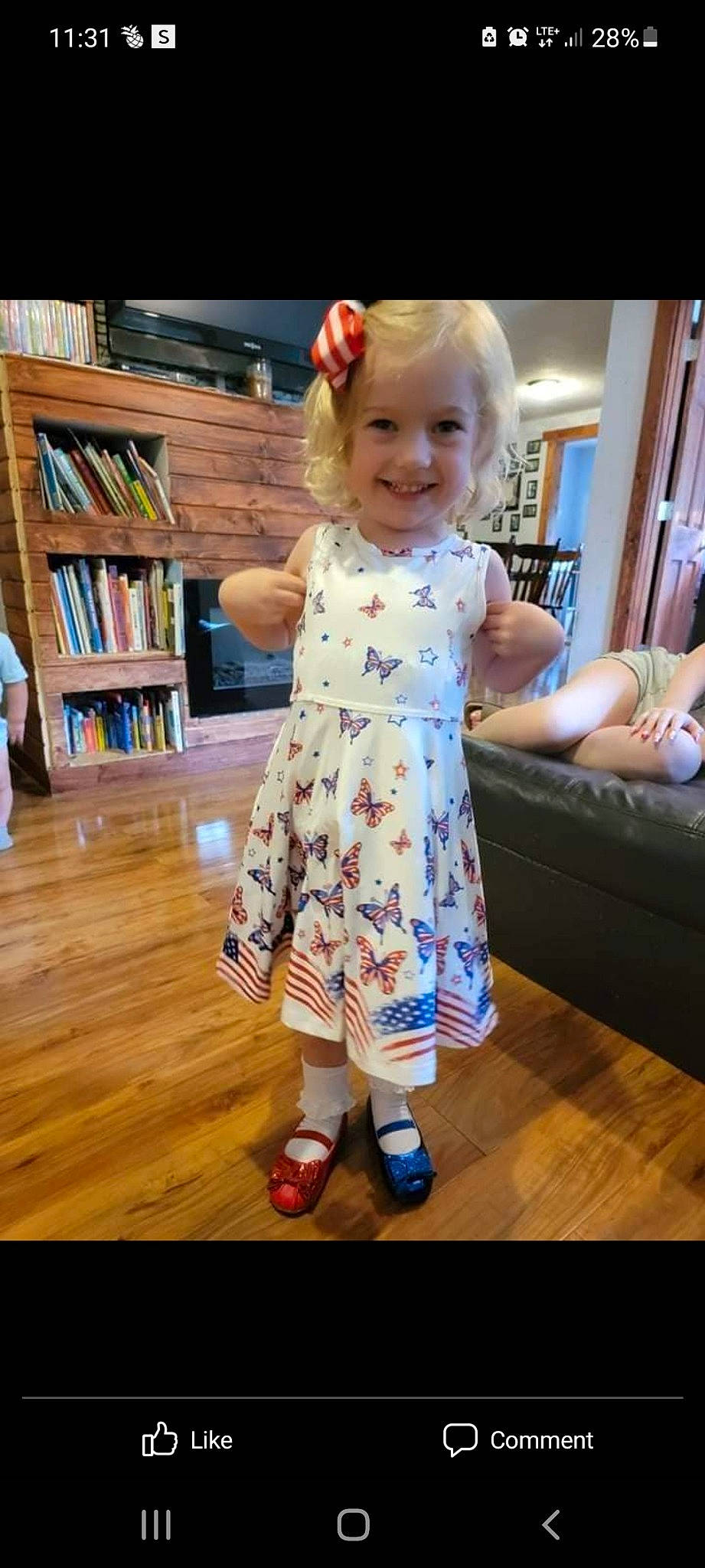 Avery joined the competition — help win amazing prizes! baby, baby_toddler_clothing, bookcase, dress, eye, face, floor, flooring, fun, hair, happy, hardwood, head, joy, person, shelf, skin, sleeve, smile, standing