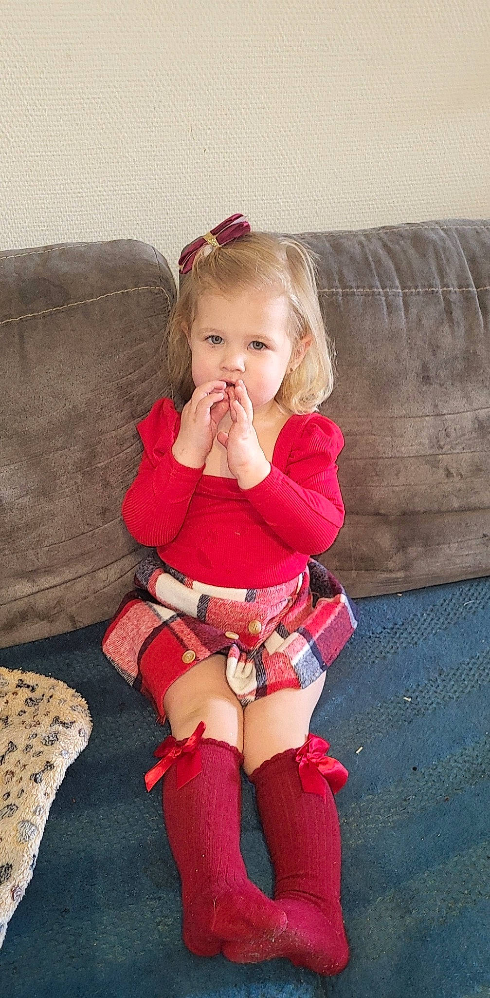 Inaya participe au concours pour gagner de l'argent avec cette photo : arm, baby_toddler_clothing, cheek, comfort, couch, dress, eye, face, hair, head, iris, knee, lap, leg, lip, neck, person, skin, sleeve, thigh