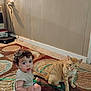 Jacob is registered to the contest to win money with this photo: cable, carpet, cat, child, curly_hair, cute, domestic_animal, floor, furniture, indoor, light, looking_at_camera, orange_cat, oxygen_tube, patterned_carpet, pet, sitting, toddler, wall, young_child