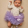Lorelei joined the competition — help win amazing prizes! baby, infant, tutu, headband, blue_eyes, onesie, purple, cute, smiling, lying_down, soft_blanket, footwear, pose, newborn, child, portrait, adorable, clothing, fashion, indoor