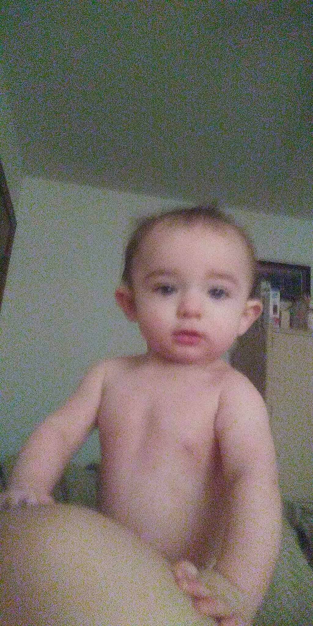 Nikolai is registered to the contest to win money with this photo: baby, bathing, bookcase, cheek, chest, child, chin, eyebrow, head, human_body, iris, jaw, neck, no_expression, nose, person, shelf, skin, thumb, toddler