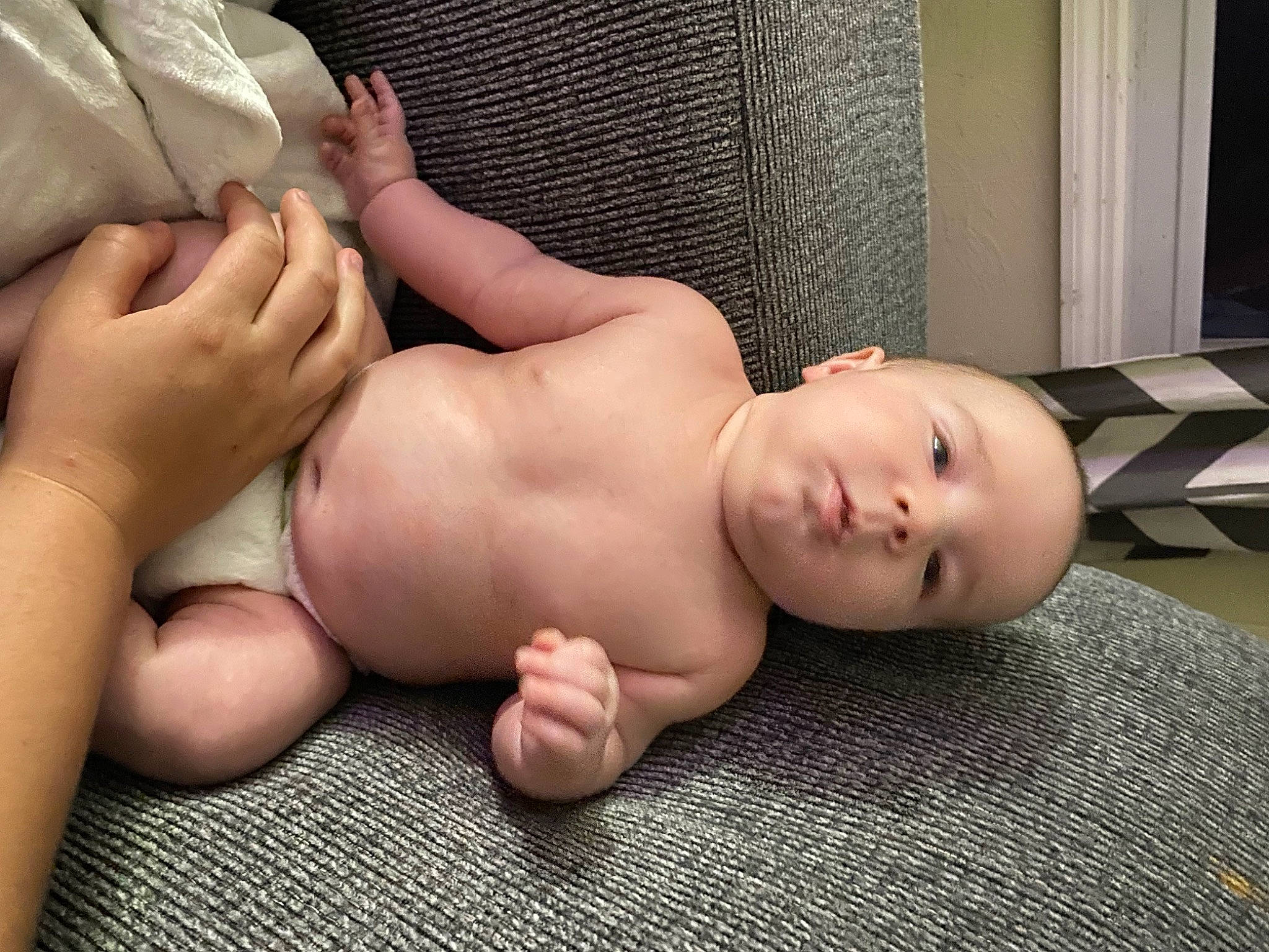 Killian is registered to the contest to win money with this photo: abdomen, barefoot, chest, comfort, finger, foot, hand, human_body, human_leg, joint, knee, leg, nail, person, skin, stomach, thigh, thumb, toddler, trunk