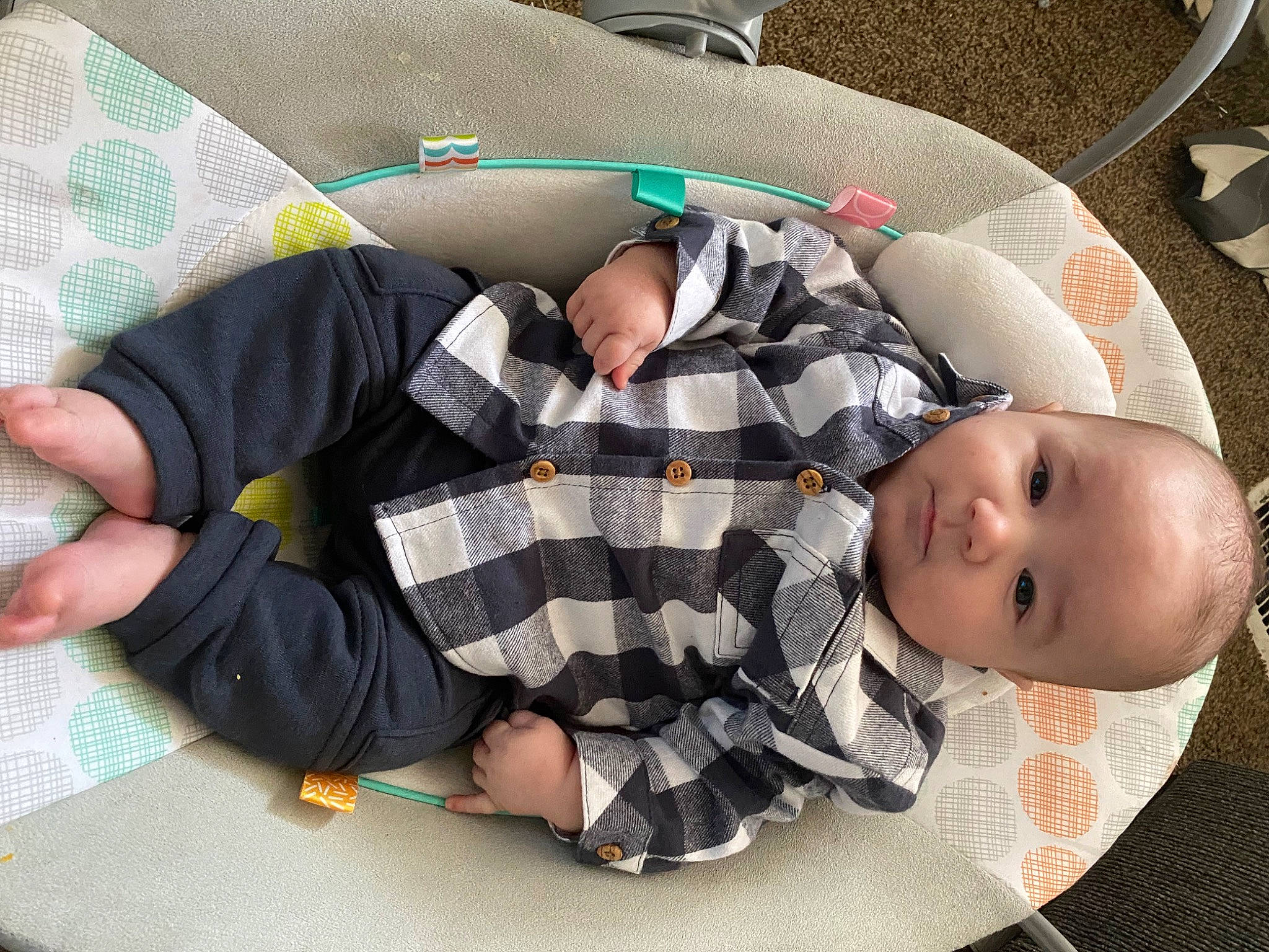 Killian is registered to the contest to win money with this photo: baby, baby_products, baby_sleeping, baby_toddler_clothing, child, comfort, finger, gesture, glasses, green, lap, linens, pattern, person, product, sitting, sleeve, sock, textile, thigh