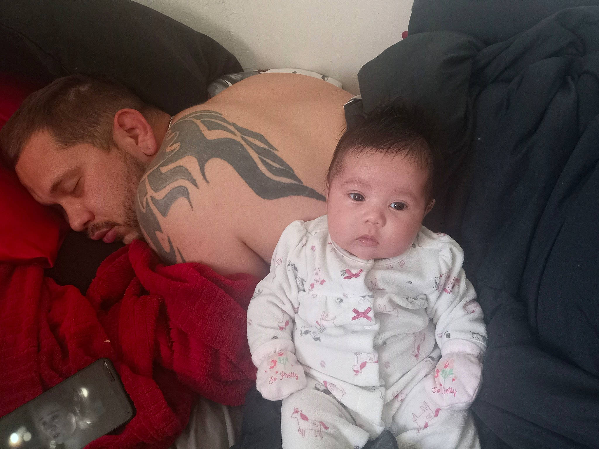 Aniya is registered to the contest to win money with this photo: baby, cheek, child, comfort, communication_device, couch, event, fun, happy, holiday, iris, lap, mobile_phone, mouth, nose, person, portable_communications_device, room, sitting, toddler