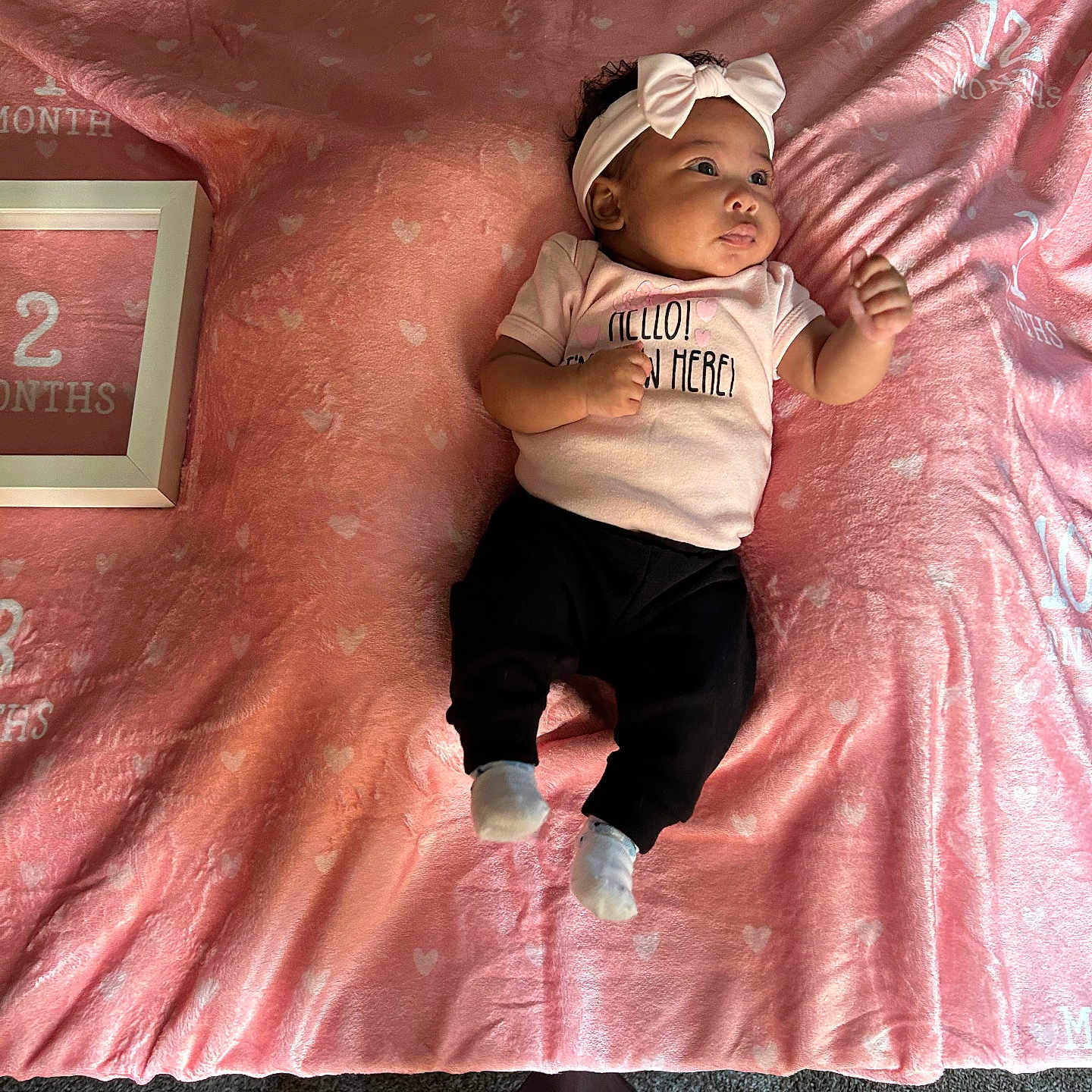 Averi joined the competition — help win amazing prizes! baby, bed, bedroom, bodypart, clothing, face, finger, furniture, hand, hat, head, hosiery, indoors, newborn, pants, person, photography, portrait, sock, t_shirt