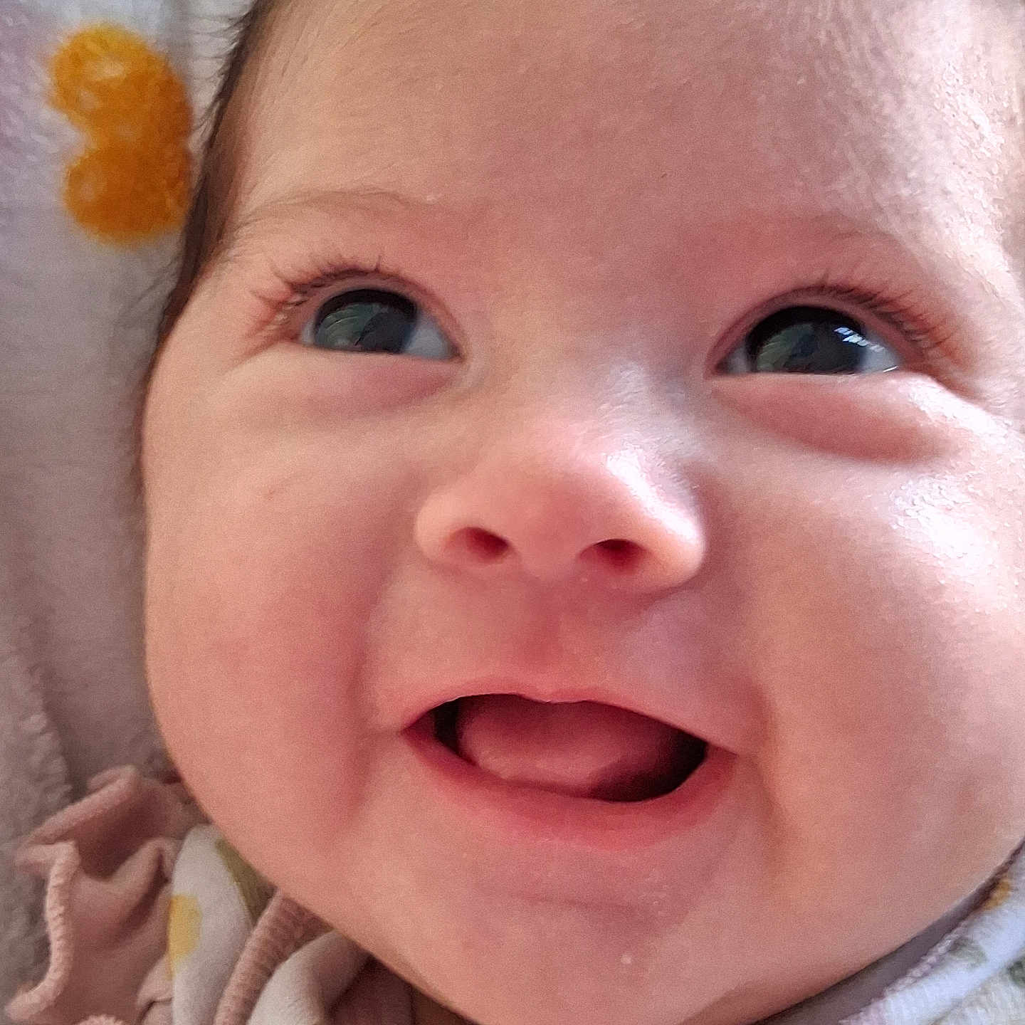 Eimy Yasmin joined the competition — help win amazing prizes! baby, close_up, smiling, face, infant, eyes, mouth, clothing, blanket, happy, cute, skin, cheeks, portrait, newborn, expression, soft, indoors, head, eyelashes