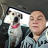 animal_face, backseat, car_interior, casual, collar, dog, face, hoodie, human_face, leisure, nose_ring, person, pet, piercing, pink_collar, portrait, seat, selfie, white_dog, window