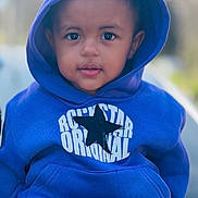 Azlen joined the competition — help win amazing prizes! toddler, child, hoodie, blue_clothing, star_logo, outdoor, portrait, cute, face, young_child, fashion, casual_wear, sitting, person, smiling, closeup, baby, headwear, jacket, leisure