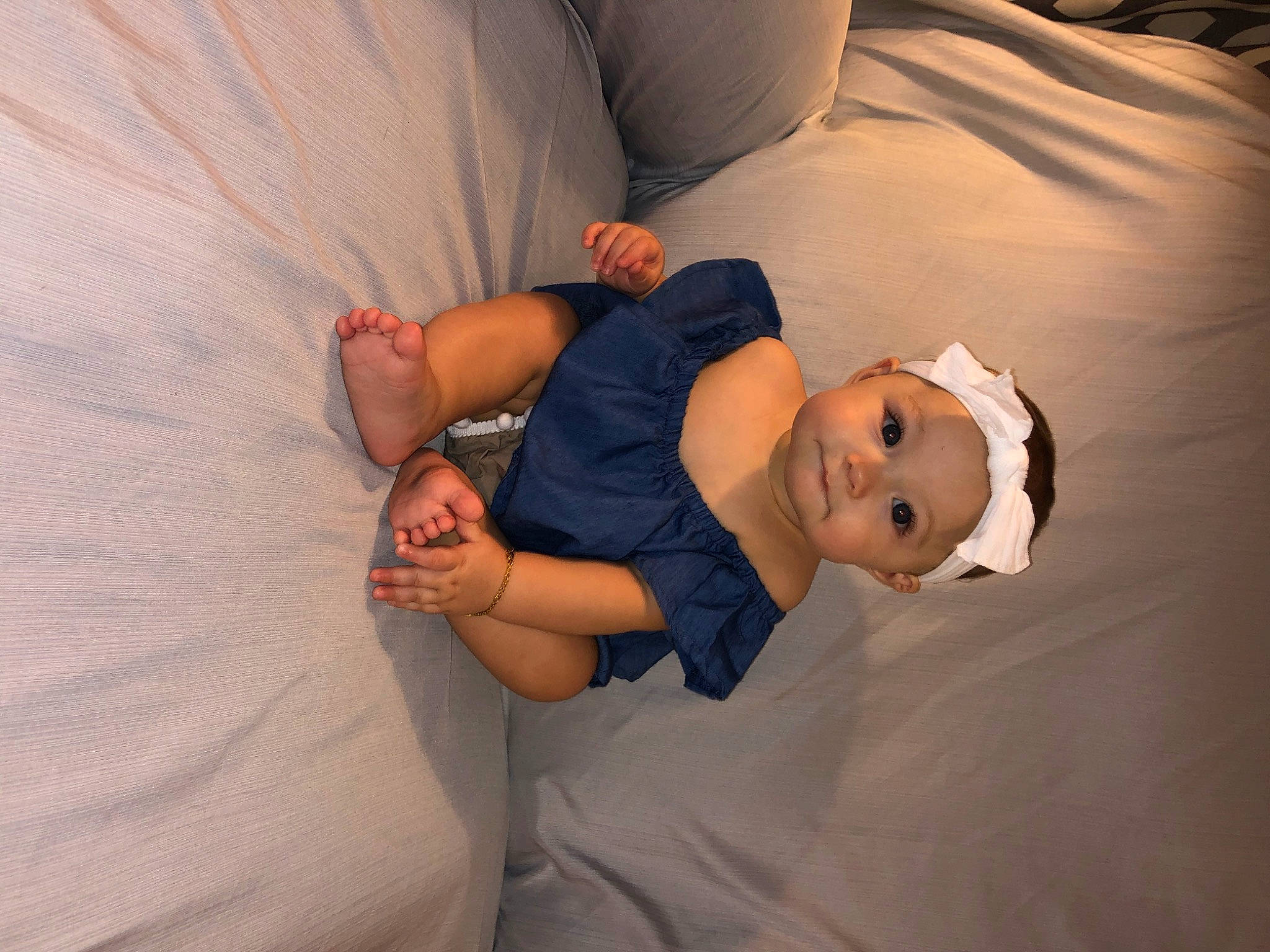 Brailee is registered to the contest to win money with this photo: abdomen, arm, baby, barefoot, child, comfort, gesture, headwear, leg, muscle, person, photography, sleep, toddler, trunk, vacation
