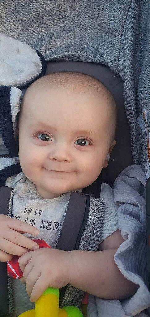 Liam is registered to the contest to win money with this photo: baby, cheek, eye, eyebrow, face, finger, flash_photography, gesture, happy, head, iris, joy, lip, mouth, nose, organ, outerwear, person, product, skin