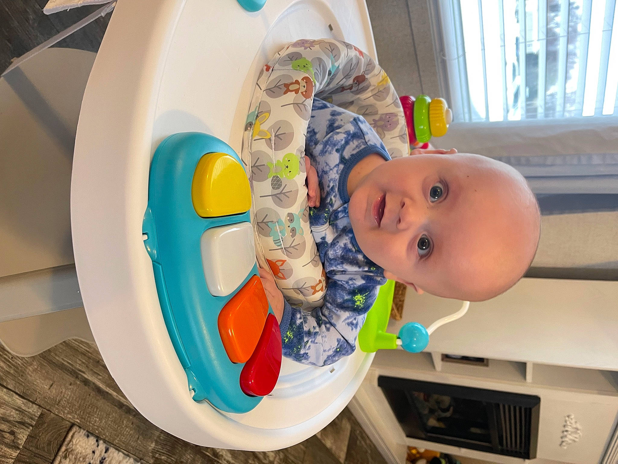 Liam joined the competition — help win amazing prizes! baby, baby_laughing, baby_products, baby_toddler_clothing, chair, child, circle, curtain, dishware, facial_expression, fun, happy, leisure, person, product, room, shelf, smile, toddler, window