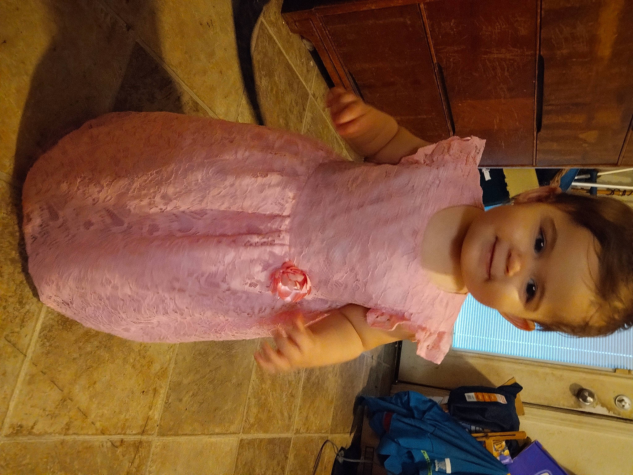 Lily joined the competition — help win amazing prizes! baby, baby_toddler_clothing, backpack, bag, child, dress, flesh, foot, fun, happy, human_leg, joy, luggage_and_bags, person, room, skin, smile, thigh, thumb, toddler