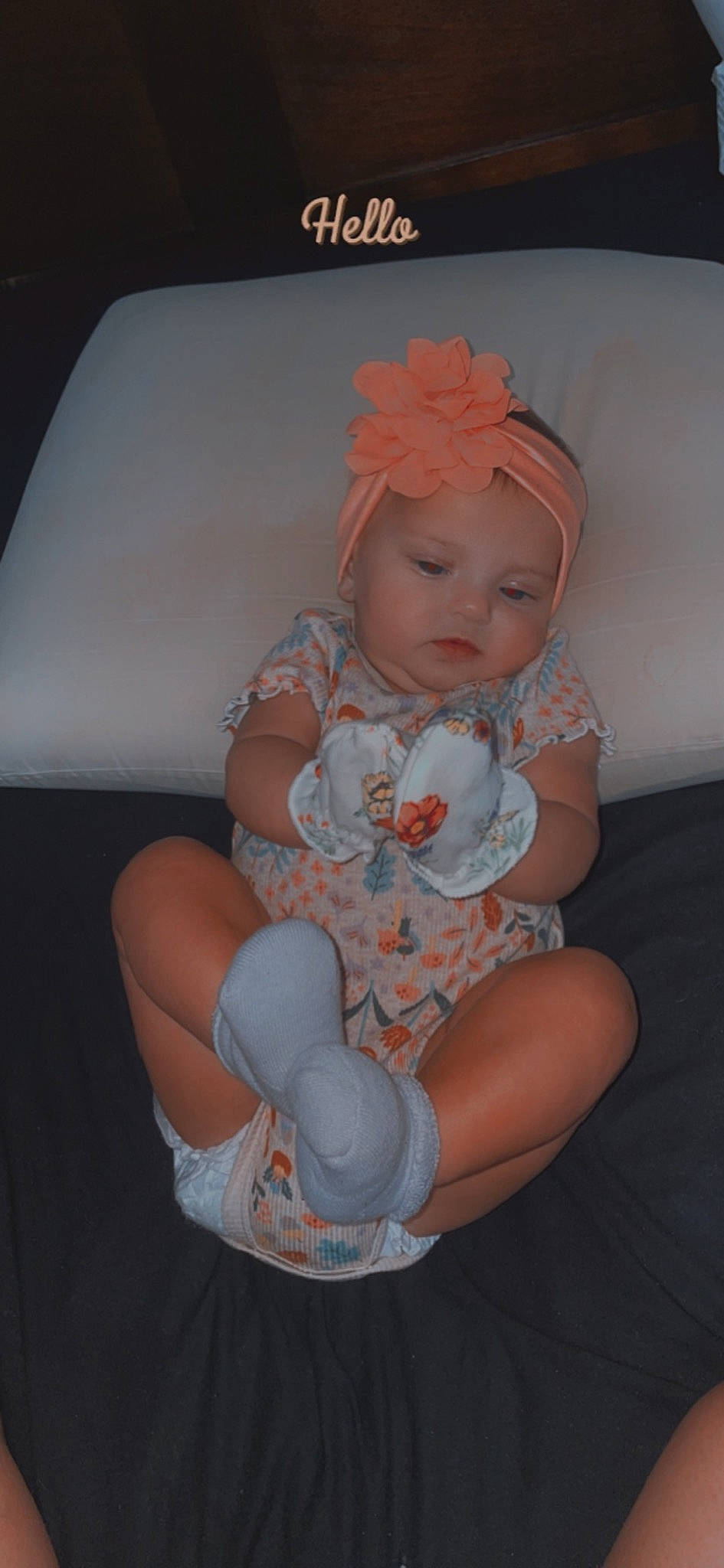 Kynlee joined the competition — help win amazing prizes! baby, baby_toddler_clothing, child, comfort, embellishment, fashion_accessory, finger, headband, headgear, headpiece, headwear, human_leg, knee, lap, nail, pattern, person, sitting, skin, sock