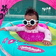 Vayla Lux joined the competition — help win amazing prizes! baby, sunglasses, swim_float, pool, water, pink, blue, flower_pattern, canopy, child, infant, smiling, summer, outdoor, fun, play, floating, cute, swim_school, protective_gear