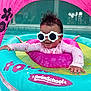 baby, sunglasses, swim_float, pool, water, pink, blue, flower_pattern, canopy, child, infant, smiling, summer, outdoor, fun, play, floating, cute, swim_school, protective_gear