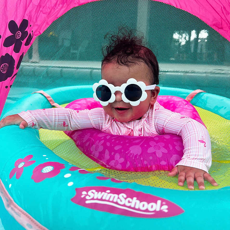 Vayla Lux joined the competition — help win amazing prizes! baby, blue, canopy, child, cute, floating, flower_pattern, fun, infant, outdoor, pink, play, pool, protective_gear, smiling, summer, sunglasses, swim_float, swim_school, water