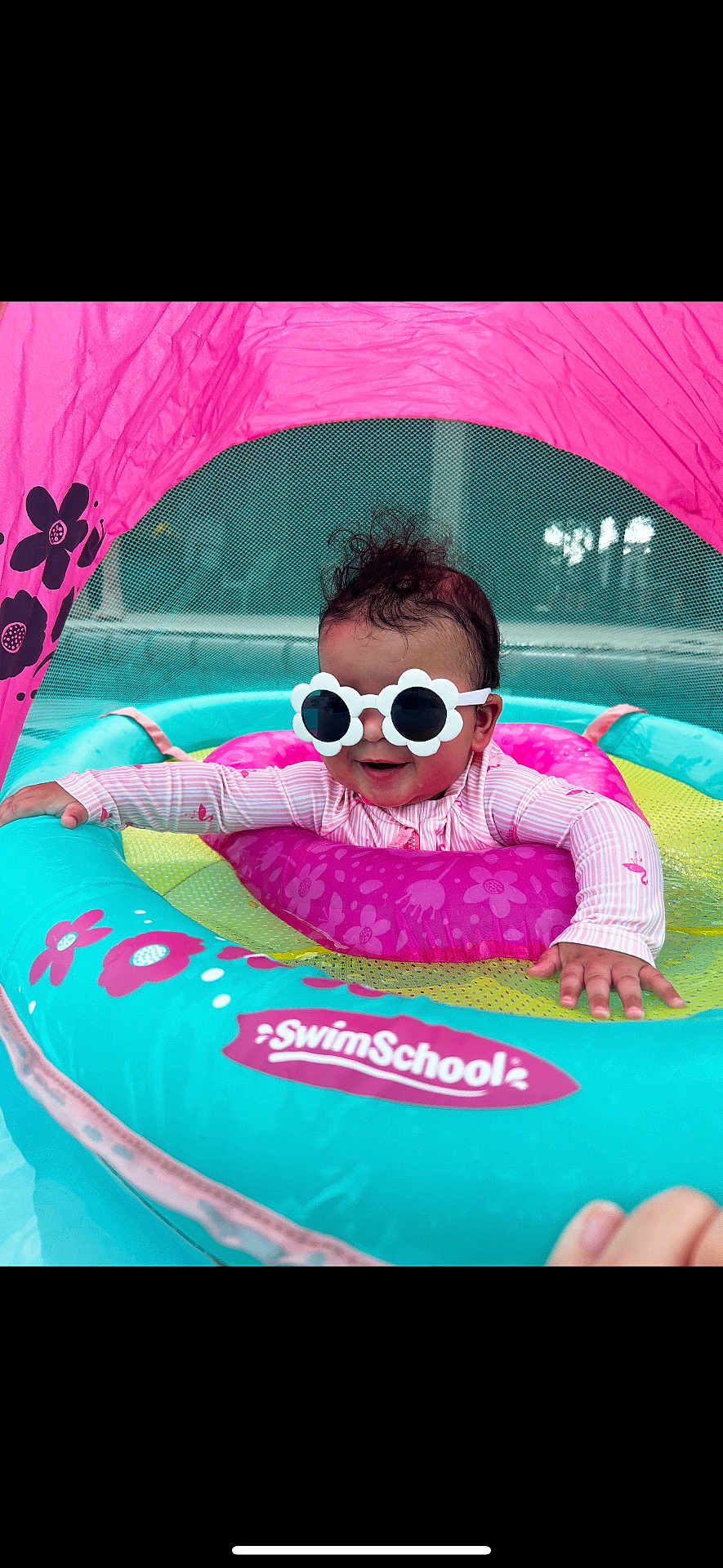 Vayla Lux joined the competition — help win amazing prizes! baby, sunglasses, swim_float, pool, water, pink, blue, flower_pattern, canopy, child, infant, smiling, summer, outdoor, fun, play, floating, cute, swim_school, protective_gear